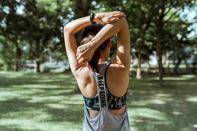 Photo by Ketut Subiyanto: https://www.pexels.com/photo/unrecognizable-female-athlete-stretching-muscles-of-arms-and-back-4426321/